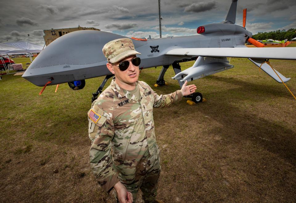 U.S. Army Warrant Officer Roger Wilson shows off an MQ-1C Gray Eagle Unmanned Aircraft at the 49th annual Sun 'n Fun Aerospace Expo at the Lakeland Linder International Airport on Monday.