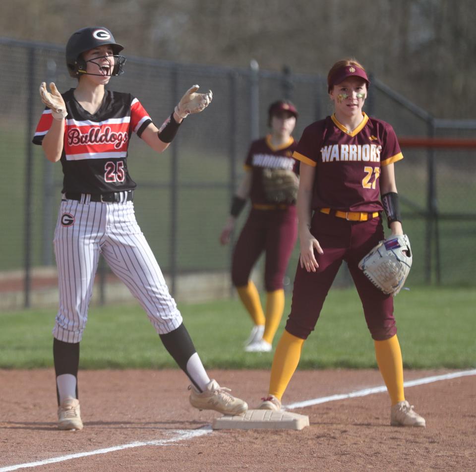 Green's Kaylie Duskey stands safely on third base and would later score to put the Bulldogs up 2-0 in the second inning against Walsh Jesuit on Tuesday, April 11, 2023 in Green.