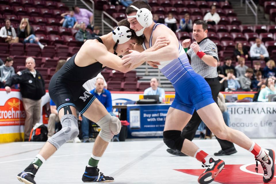 Fort LeBoeuf's Jojo Przybycien, right, tries to make a late attack on Reynolds' Chase Bell during a 133-pound quarterfinal bout at the PIAA Class 2A wrestling championships at the Giant Center on Friday in Derry Township. Bell won by decision, 3-2.