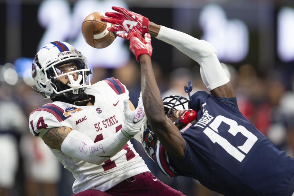 South Carolina State cornerback Decobie Durant (14) breaks up a pass intended for Jackson State's Malachi Wideman.