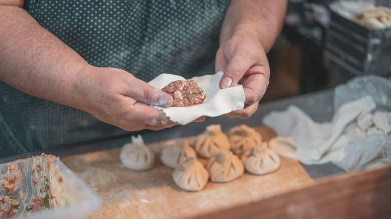 Person making pelmeni