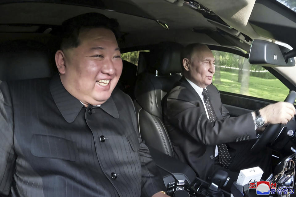 In this photo provided by the North Korean government, Russia's President Vladimir Putin, right, drives a car with North Korean leader Kim Jong Un sitting in front passenger seat at a garden of the Kumsusan State Guest House in Pyongyang, North Korea Wednesday, June 19, 2024. Independent journalists were not given access to cover the event depicted in this image distributed by the North Korean government. The content of this image is as provided and cannot be independently verified. Korean language watermark on image as provided by source reads: "KCNA" which is the abbreviation for Korean Central News Agency. (Korean Central News Agency/Korea News Service via AP)