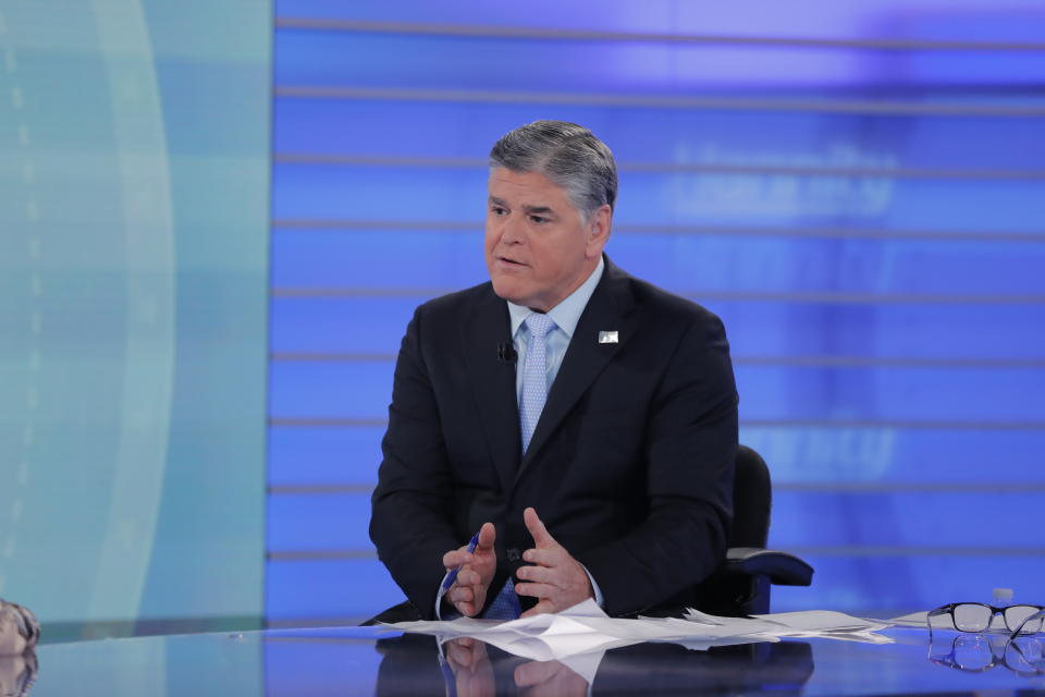 Fox News talk show host Sean Hannity interviews Roseanne Barr during a taping of his show, Thursday, July 26, 2018, in New York. Roseanne Barr will appear on on the Fox News show "Hannity" on Thursday at 9 p.m. EDT for the first time since she was fired from ABC and her namesake show was canceled. ABC canceled its successful reboot of "Roseanne" in May following the star's racist tweet likening former Obama adviser Valerie Jarrett to a cross between the Muslim Brotherhood and a "Planet of the Apes" actor. (AP Photo/Julie Jacobson)