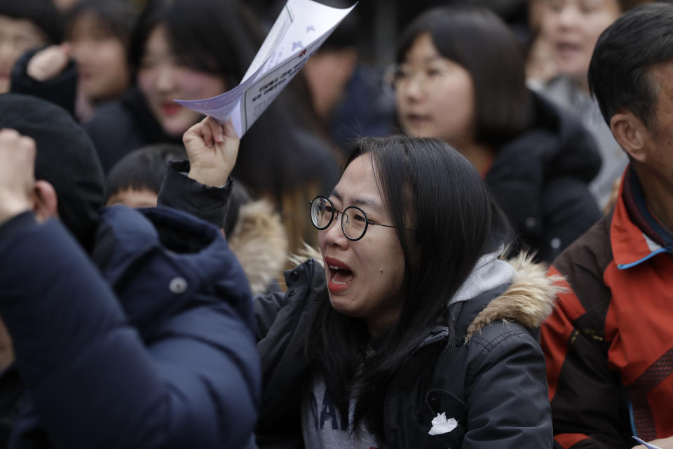A participant shouts slogans during a weekly rally near the Japanese Embassy in Seoul, South Korea, Wednesday, Jan. 30, 2019. Hundreds of South Koreans are mourning the death of a former sex slave for the Japanese military during World War II by demanding reparations from Tokyo over wartime atrocities. (AP Photo/Lee Jin-man)