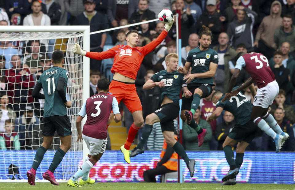 Burnley goalkeeper Nick Pope makes a save from an Aston Villa shot on goal, during the Premier League match at Villa Park in Birmingham, Saturday Sept. 28, 2019. (Nick Potts/PA via AP)