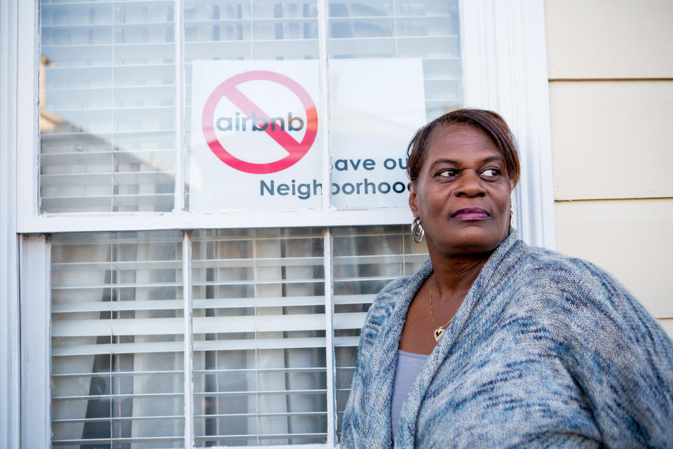 Janice Coatney stands outside her Treme home.