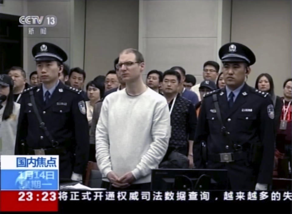 In this image taken from a video footage run by China's CCTV, Canadian Robert Lloyd Schellenberg attends his retrial at the Dalian Intermediate People's Court in Dalian, northeastern China's Liaoning province on Monday, Jan. 14, 2019. A Chinese court sentenced the Canadian man to death Monday in a sudden retrial in a drug smuggling case that is likely to escalate tensions between the countries over the arrest of a top Chinese technology executive. (CCTV via AP)