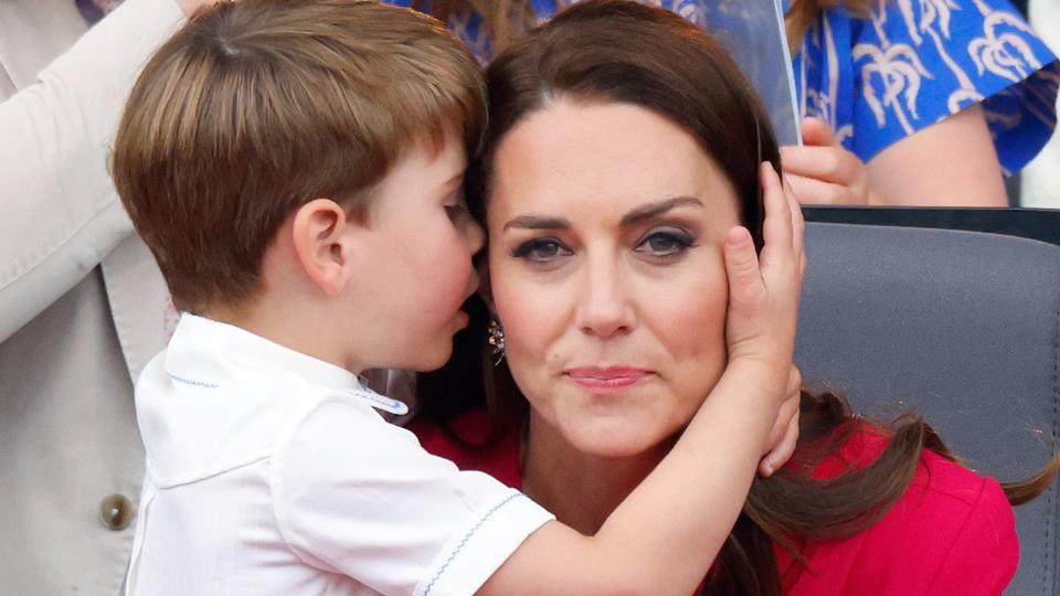 Prince Louis hugging Princess Kate in pink