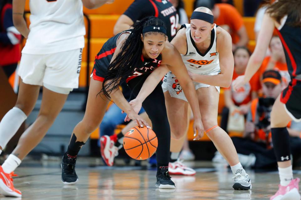 Oklahoma State Cowgirls guard Rylee Langerman (11) reaches for the ball beside Texas Tech Lady Raiders guard Jasmine Shavers (3) during a women's college basketball game between the Oklahoma State Cowgirls (OSU) and the Texas Tech Lady Raiders at Gallagher-Iba Arena in Stillwater, Okla., Wednesday, Jan. 10, 2024. Oklahoma State won 71-58.