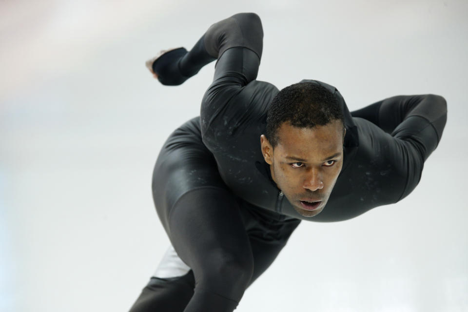 Shani Davis of the U.S. skates in the prototype of the official US Speedskating suit during a training session at the Adler Arena Skating Center at the 2014 Winter Olympics, Friday, Feb. 14, 2014, in Sochi, Russia.