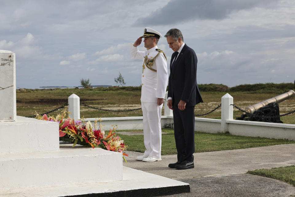 U.S. Secretary of State Antony Blinken, right, attends a wreath-laying ceremony at Tonga's War Memorial in Nuku'alofa, Tonga Wednesday, July 26, 2023. (Tupou Vaipulu/Pool Photo via AP)