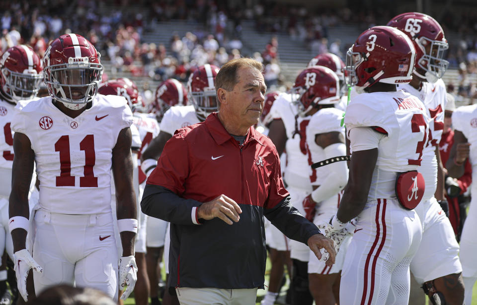 Alabama coach Nick Saban walks onto the field with players before the game against the Texas A&M Aggies at Kyle Field. (Troy Taormina-USA TODAY Sports)