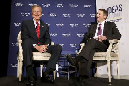 Former Governor Jeb Bush (R-FL) (L) is interviewed onstage by Rich Lowry of the National Review during the National Review Institute's 2015 Ideas Summit in Washington, April 30, 2015. REUTERS/Jonathan Ernst