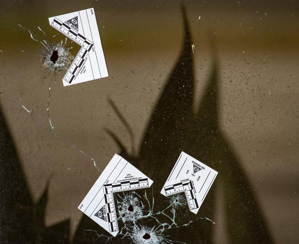 Bullet holes riddle an apartment window on Iowa Avenue on Tuesday, Jan. 31, 2023, where a drive by shooting occurred Monday afternoon in Lakeland, wounding 11 people.