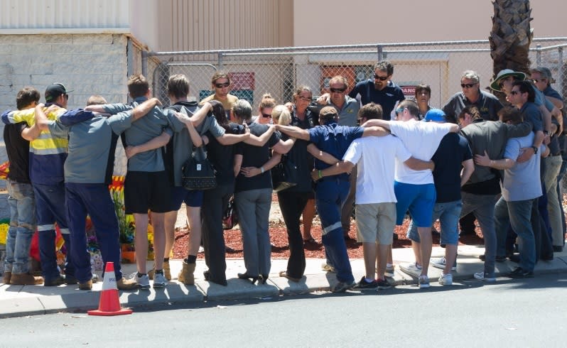 Workmates gather at the scene of yesterday's fatal explosion. Picture:Mogens Johansen/The West Australian