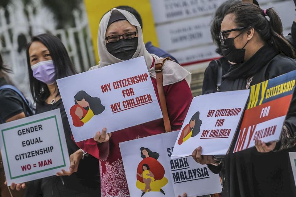 Members of Family Frontiers and the affected Malaysian mothers are seen holding placards to say that their children should also have the right to be Malaysian citizens, April 27, 2021. ― Picture by Hari Anggara