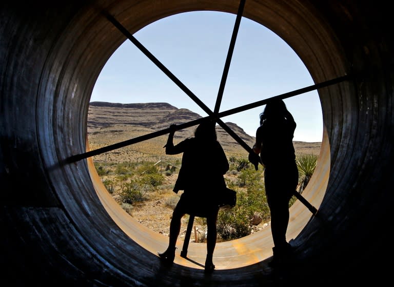 Visitors get a chance to inspect the inside of a Hyperloop tube during the first open air propulsion test at the Hyperloop One Test and Safety site in Las Vegas, Nevada, on May 11, 2016