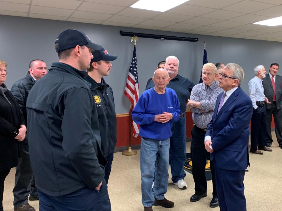 Governor Mike DeWine chatted with firefighters from Waldo's Fort Morrow Fire Department after the Dec. 7 announcement of the new water system.