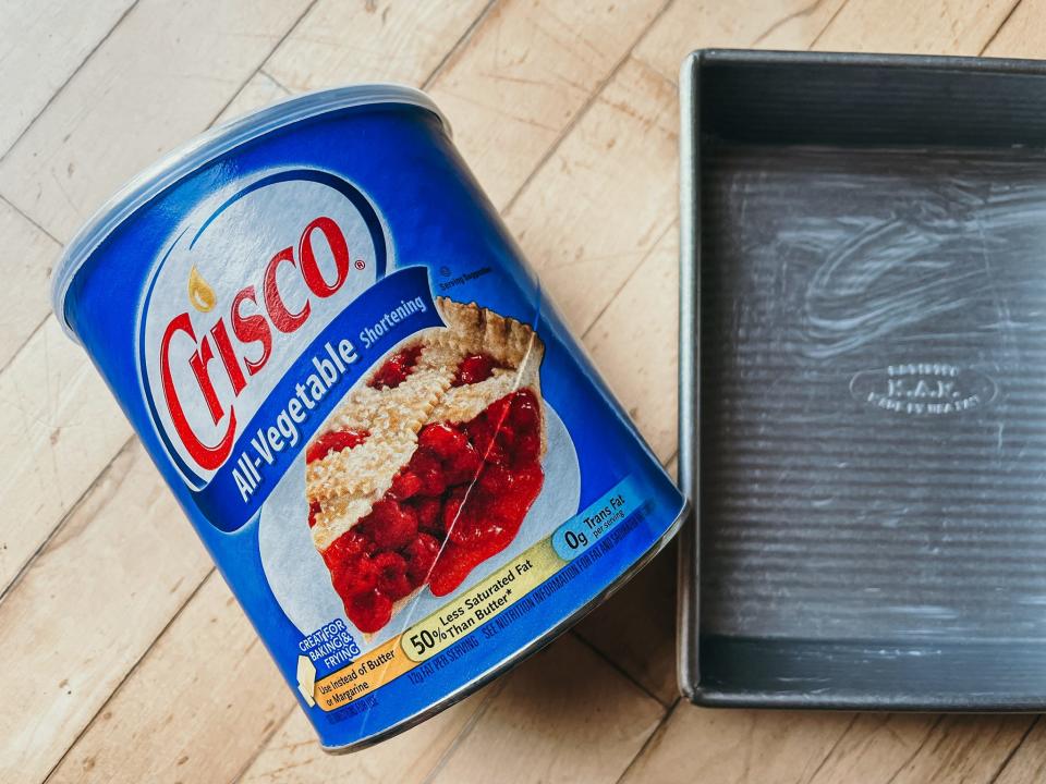 can of crisco next to an 8x8 square metal pan