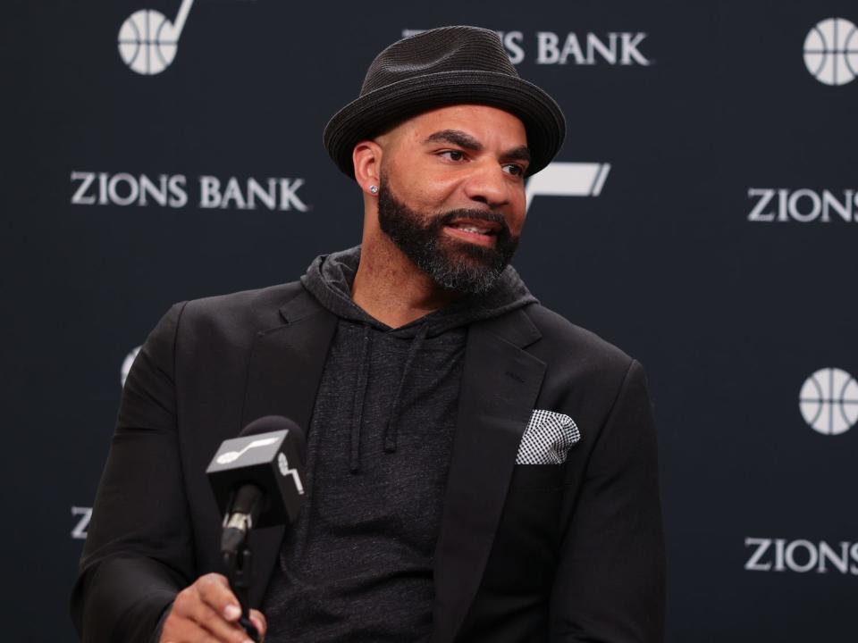 Carlos Boozer speaks to a reporters at a press conference in 2022.