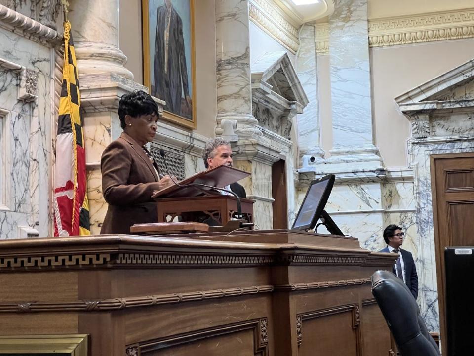 Maryland House of Delegates Speaker Adrienne Jones, D-Baltimore County, stands on the Speaker's rostrum with Jim Kercheval, the executive director of the Greater Hagerstown Committee, during the Washington County Day in Annapolis on Jan. 23, 2024.