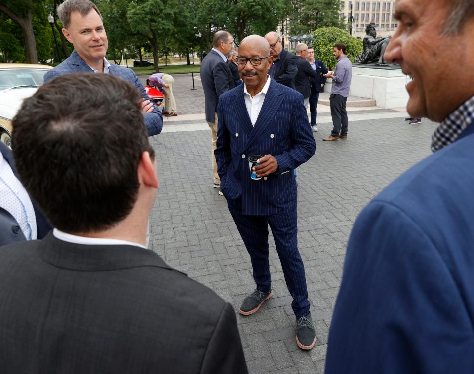 Ed Welburn, former General Motors Vice President of Global Design, talks with others in front of the Detroit Institute of Arts in Detroit on Thursday, Aug. 2, 2022, during a preview of the Detroit Concours d'Elegance classic car show happening in September.