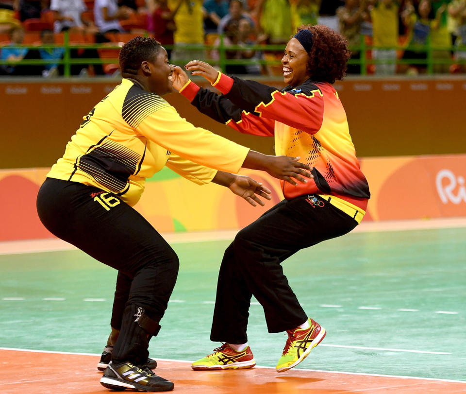 <p>Teresa Patrica Alemida of Angola celebrates after the Women’s Handball match between Romania and Angola on Day 1 of the Rio 2016 Olympic Games at Future Arena on August 6, 2016 in Rio de Janeiro, Brazil. (Photo by Ross Kinnaird/Getty Images) </p>