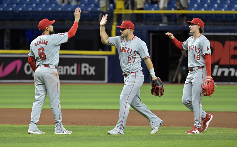 Los Angeles Angels' Anthony Rendon (6), Mike Trout (27) and Mickey Moniak (16) celebrate after the team's win over the Tampa Bay Rays in a baseball game Wednesday, April 17, 2024, in St. Petersburg, Fla. (AP Photo/Steve Nesius)