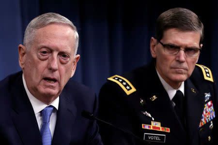 U.S. Defense Secretary James Mattis (L) and Army Gen. Joseph Votel, commander of U.S. Central Command, brief the media at the Pentagon in Washington, U.S., April 11, 2017. REUTERS/Yuri Gripas