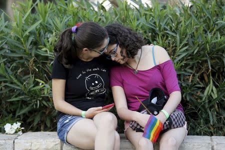 Participants of an annual gay pride parade react after an Orthodox Jewish assailant stabbed and injured six participants in Jerusalem on Thursday, police and witnesses said July 30, 2015. REUTERS/Amir Cohen