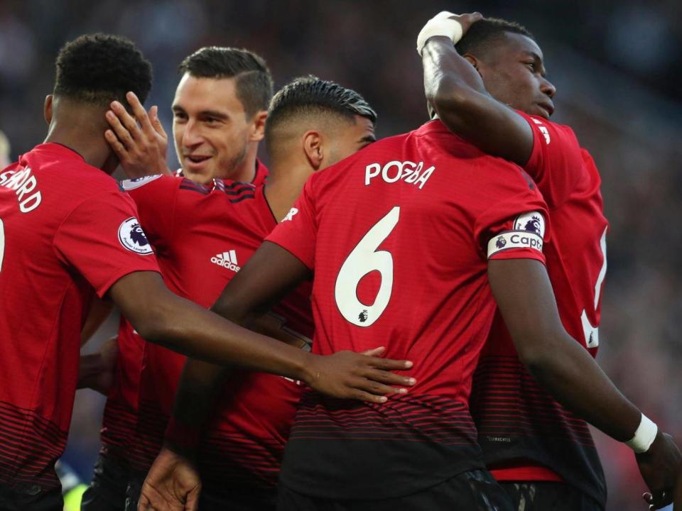 Paul Pogba celebrates scoring United's opener on Friday night (AP)