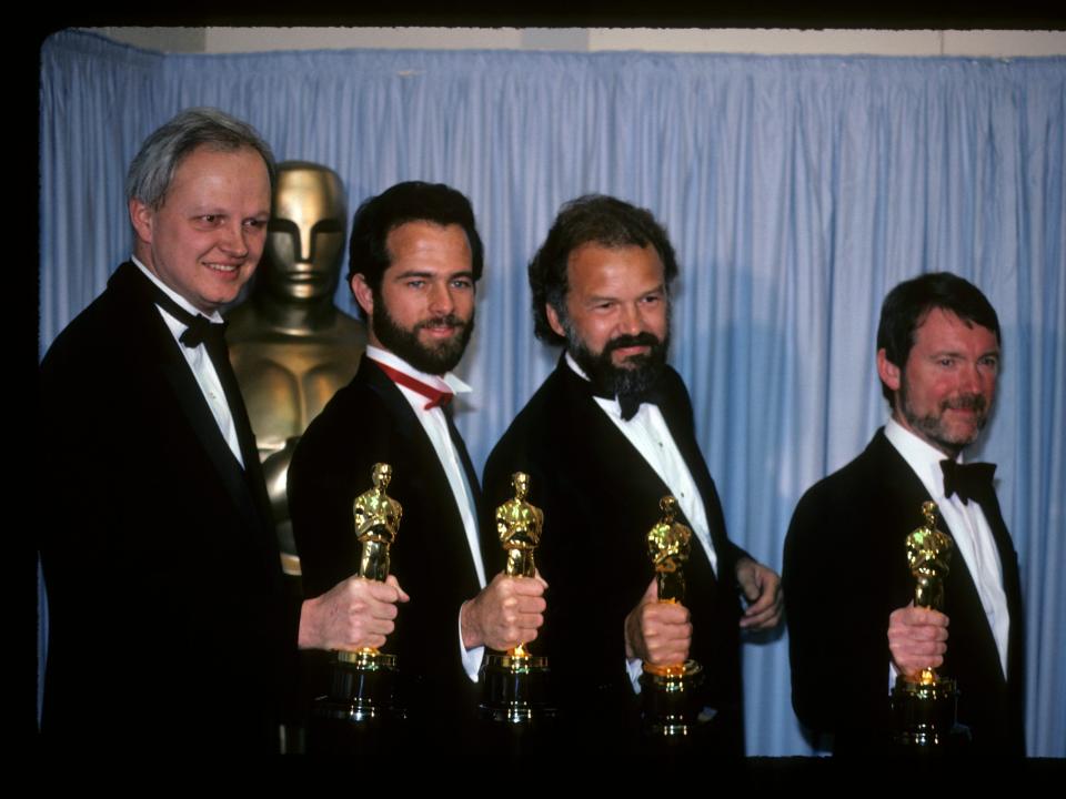 From left to right: Dennis Muren, Michael J. McAlister, Lorne Peterson, and George Gibbs pose with their Academy Awards for "Best Visual Effects" for "Indiana Jones and the Temple of Doom."