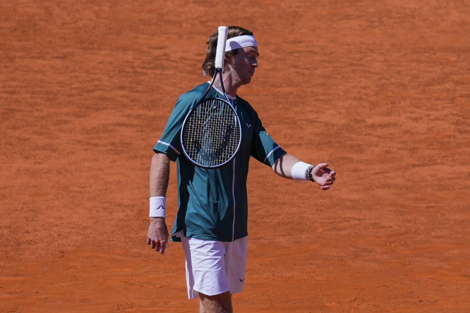 Andrey Rublev, of Russia, throws the racket during a match against Taylor Fritz, of United States, during the Mutua Madrid Open tennis tournament in Madrid, Spain, Friday, May 3, 2024. (AP Photo/Bernat Armangue)