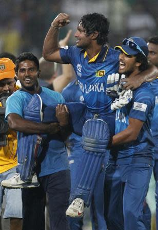 Sri Lanka's players celebrate after they won the ICC Twenty20 World Cup cricket title after beating India at the Sher-E-Bangla National Cricket Stadium in Dhaka April 6, 2014. REUTERS/Andrew Biraj