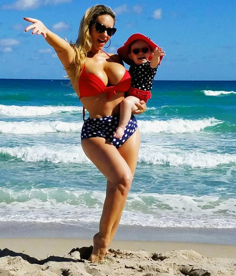 The two share their affinity for the color red and polka-dots during a beach outing.