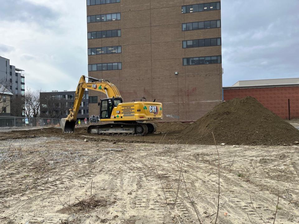 An excavator begins digging a hole for a stormwater retention tank on the CityPlace site on Nov. 15, 2022.