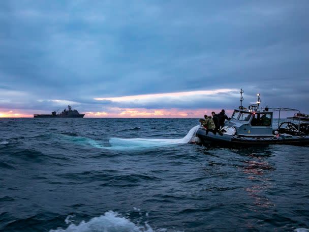 PHOTO: Sailors assigned to Explosive Ordnance Disposal Group 2 recover a high-altitude surveillance balloon off the coast of Myrtle Beach, S.C., Feb. 5, 2023, after it was shot down. (Department of Defense)