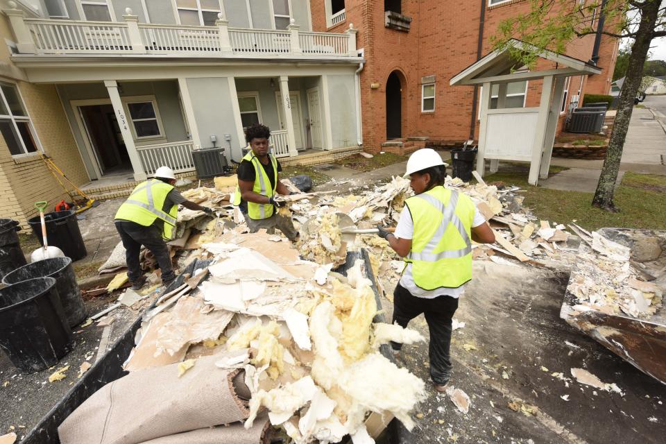 Construction crew work to clear debri from the Jervay Community in November 2018 following Hurricane Florence. Nearly three years later, one complex is still waiting for needed renovations.