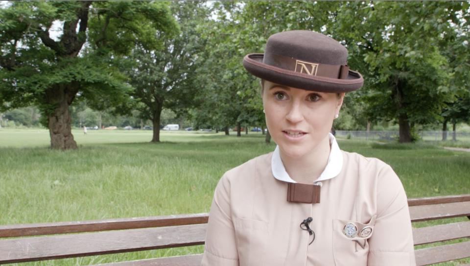 Image of Alice in Norland uniform sitting in a park