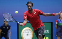 Gael Monfils, of France, returns to Matteo Berrettini, of Italy, during the quarterfinals of the U.S. Open tennis championships Wednesday, Sept. 4, 2019, in New York. (AP Photo/Frank Franklin II)