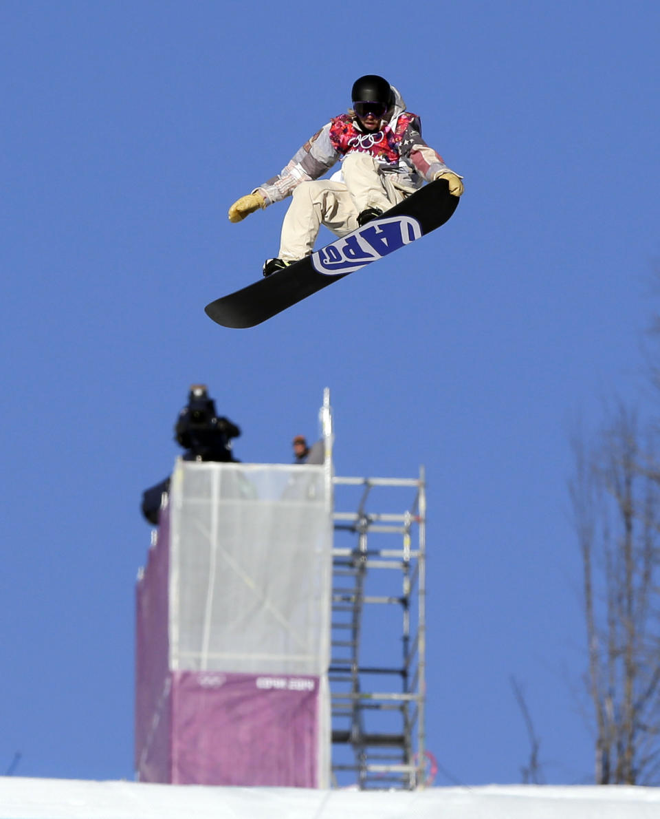 United States' Sage Kotsenburg takes a jump during the men's snowboard slopestyle semifinal at the Rosa Khutor Extreme Park, at the 2014 Winter Olympics, Saturday, Feb. 8, 2014, in Krasnaya Polyana, Russia. (AP Photo/Andy Wong)