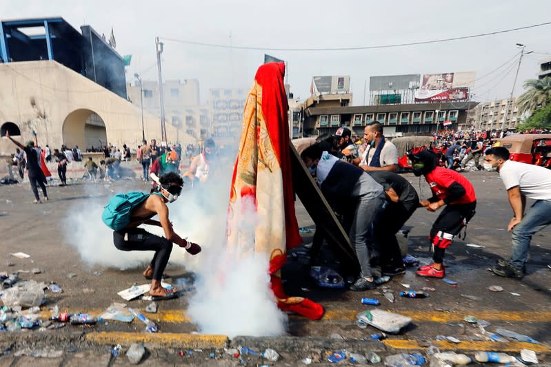 Demonstrators take part in a protest over corruption, lack of jobs, and poor services, in Baghdad