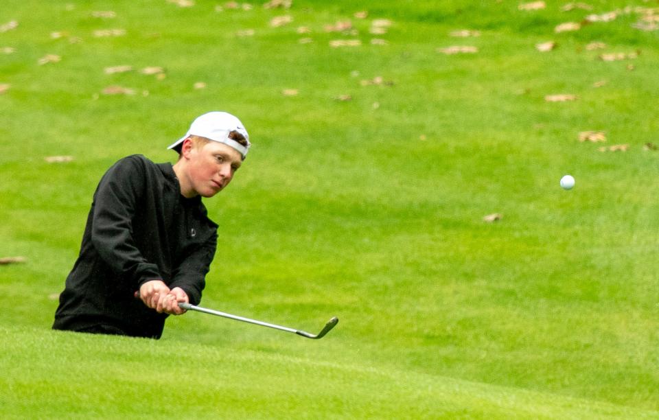 Hopedale's CJ Kivlehan chips onto the ninth green during the Division 3 state golf championship at Sterling National.