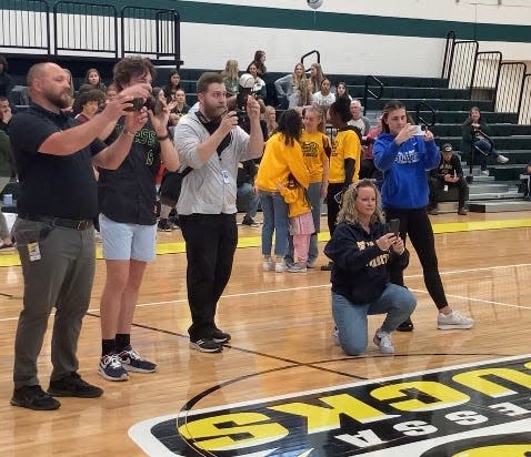 Staff, friends and family take photos at Odessa High School’s first athletic signing ceremony on Thursday.