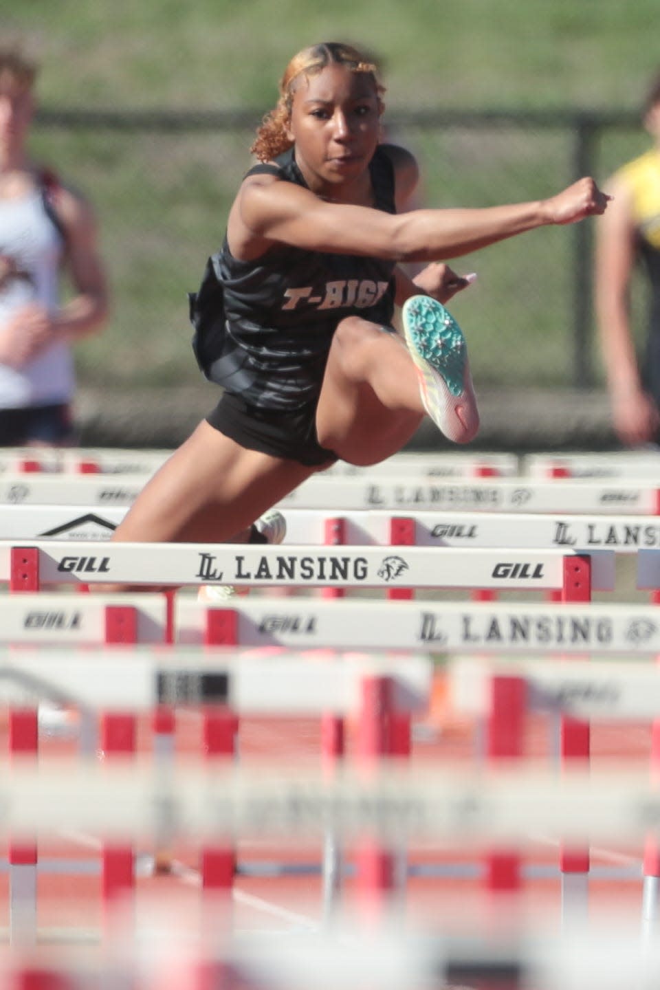 Topeka High's Aubreona Torres-Hill sets a personal record and second place in the 100 meter hurdles at the Lansing Invitational with a time of 17 seconds last week.