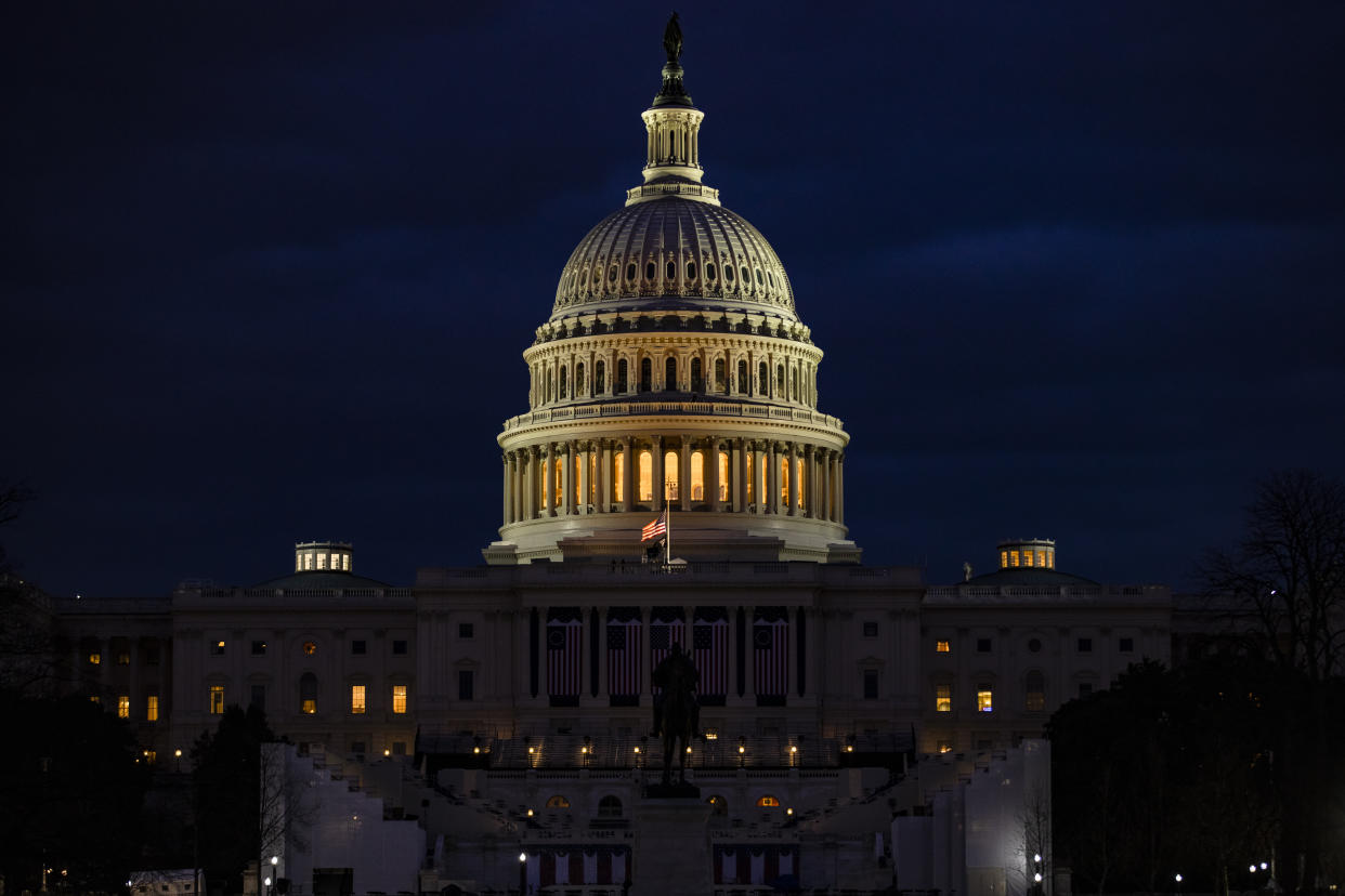 <p>The US Capitol and the stages built for the Presidential Inauguration ceremony on 17 January 2021 in Washington, DC. After last week's riots at the U.S. Capitol Building, the FBI has warned of additional threats in the nation's capital and in all 50 states.</p> (Getty Images)