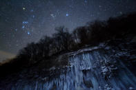 Japanese photographer Masahiro Miyasaka captured an icy scene in Nagano, Japan, with the blue stars of the Pleiades glowing overhead. Despite the icy glow, blue stars are actually much hotter and more massive than red stars.