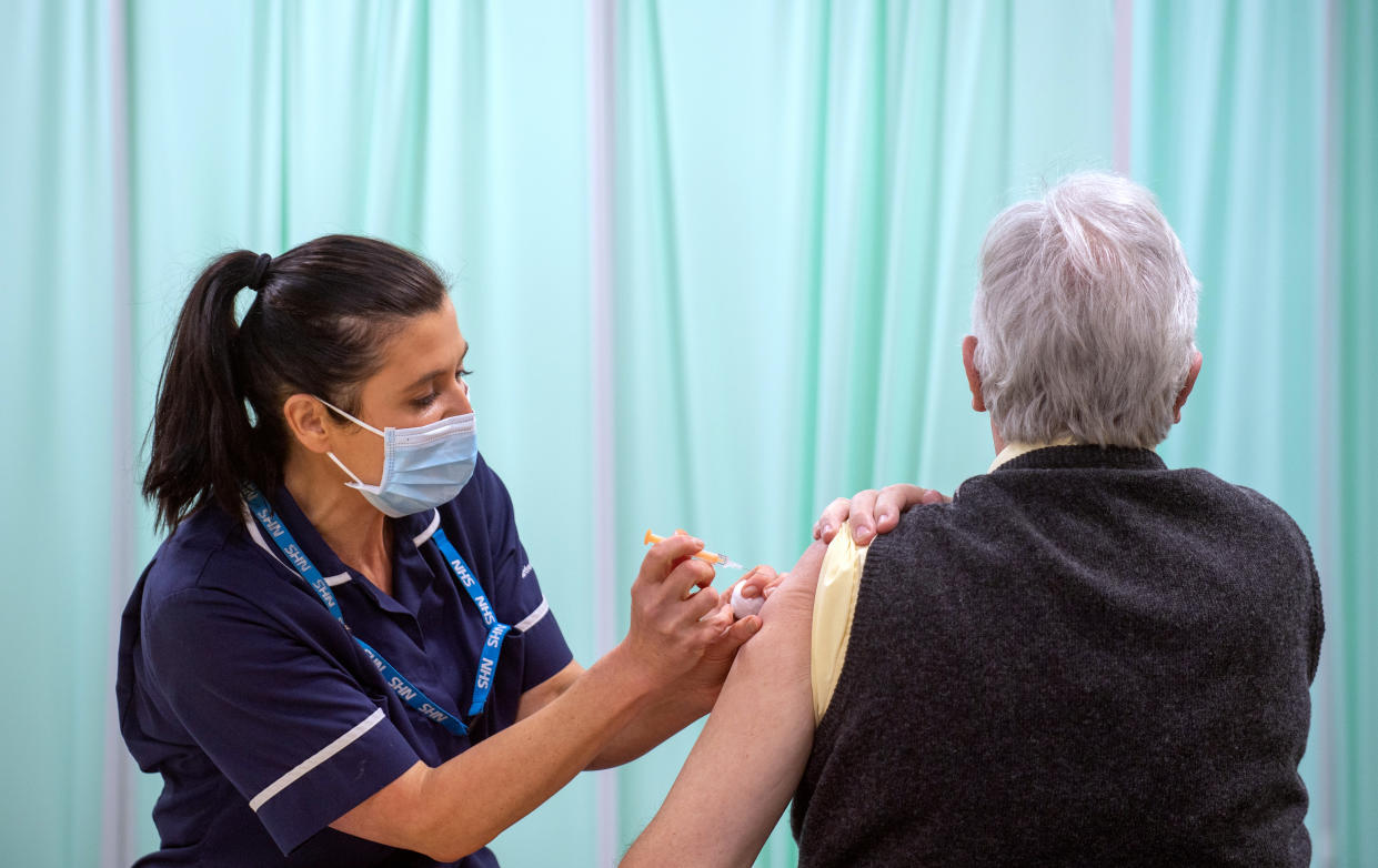 A patient receives an injection of a Covid-19 vaccine at the NHS vaccine centre that has been set up at Robertson House in Stevenage, Hertfordshire. The centre is one of the seven mass vaccination centres now opened to the general public as the government continues to ramp up the vaccination programme against Covid-19.