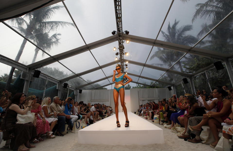 A model wears swimwear from the Aqua di Lara collection of during the Mercedes-Benz Fashion Week Swim 2013 show, Saturday, July 21, 2012, in Miami Beach, Fla. (AP Photo/Lynne Sladky)