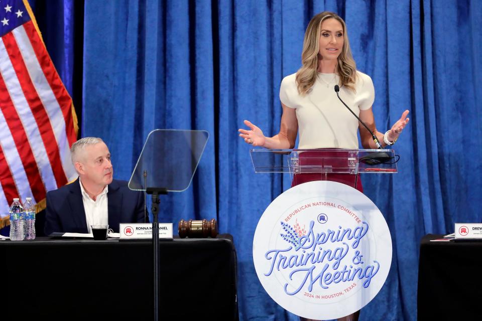 Lara Trump, the newly elected Republican National Committee Co-Chair, right, gives an address as newly elected Chairman Michael Whatley, left, listens during the general session of the RNC Spring Meeting Friday, March 8, 2024, in Houston.